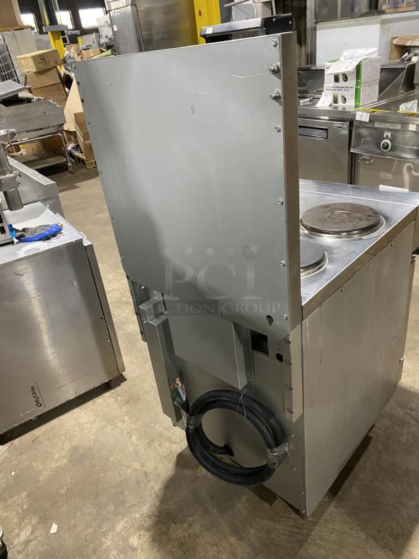 Cookline ER24-208 stainless steel 4-burner range/oven combo with backsplash and wired oven rack. Electric, 208V, on legs.