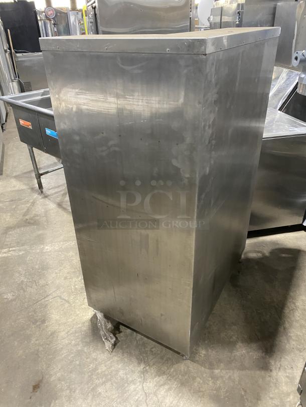 Commercial stainless steel open front cupboard unit on legs, in used condition. Ideal for storage, durable construction.