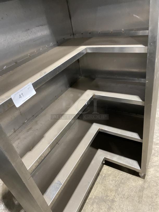 Commercial stainless steel open front cupboard unit on legs, multi-tiered shelves, sturdy construction, item tag "41".