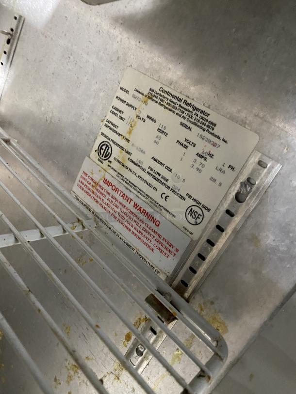 Continental SW72-18 stainless steel refrigerated prep table, 3-door, with polly coated rack, 115V, on casters, working condition.