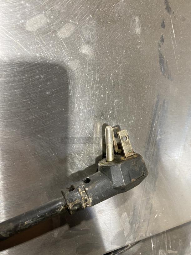 Continental SW72-18 refrigerated prep table plug detail showing wear.