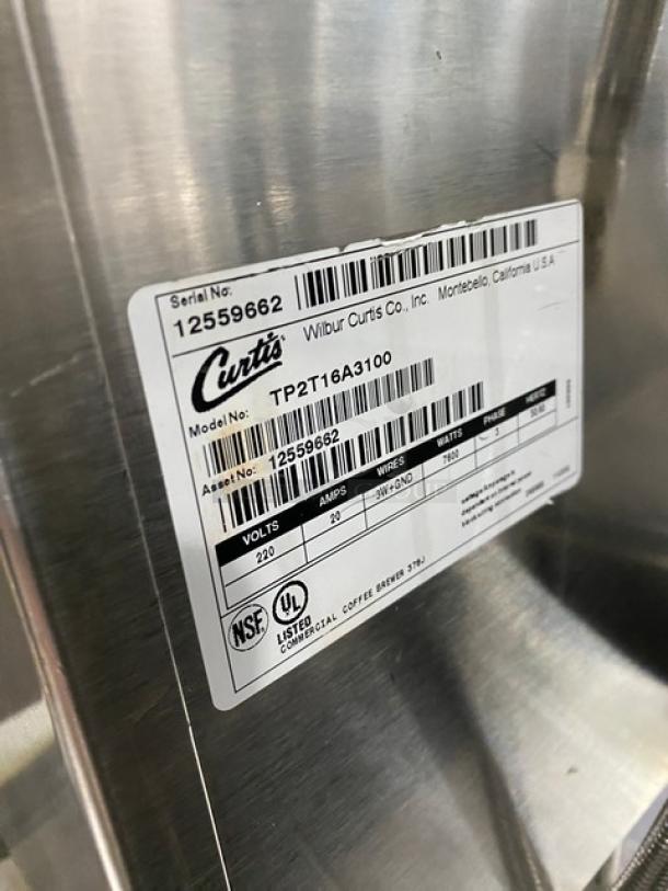 Curtis Thermopro TP2T16A3100 commercial stainless steel twin coffee brewer with digital controls, model and serial number label visible.