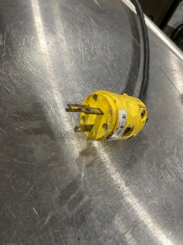 Yellow power plug for Beverage-Air Refrigerated Chef Base WTRCS36148, showing three prongs and a label.