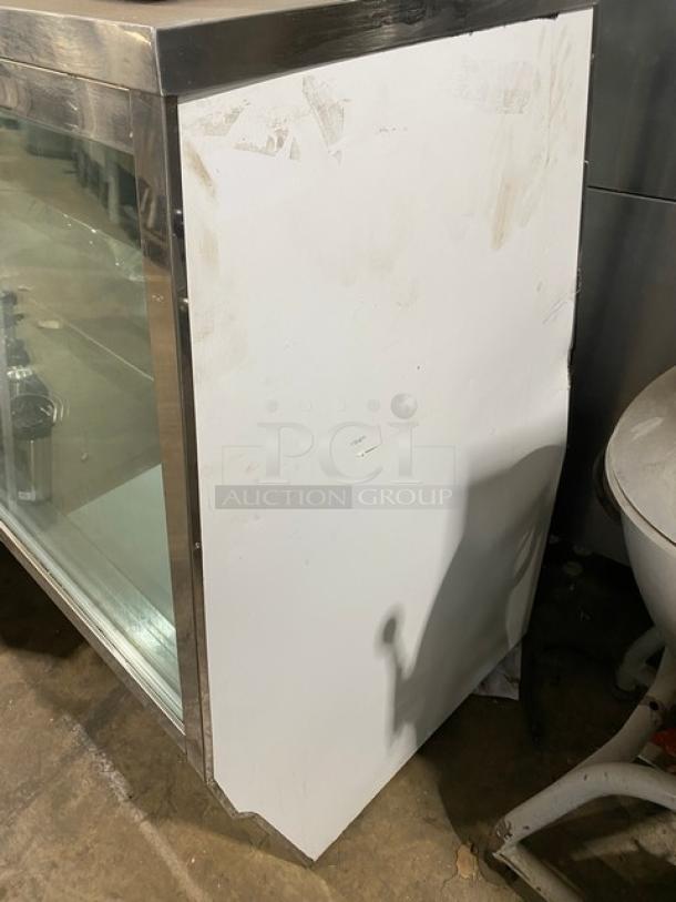 Custom Cool DEL4SC refrigerated meat deli display case, stainless steel, slanted glass, 48", with double glass sliding doors.