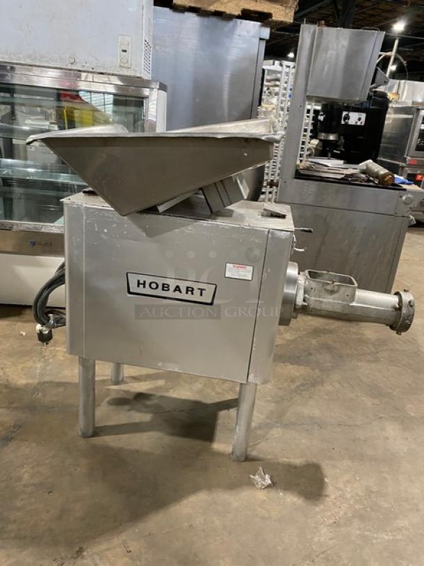 Hobart commercial electric meat chopper/grinder on legs, stainless steel, high capacity, good condition, visible brand label.