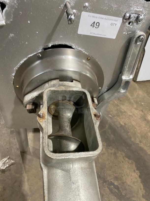 Hobart commercial electric meat chopper/grinder on legs, high capacity, heavy duty, visible wear, attached tag with auction details.