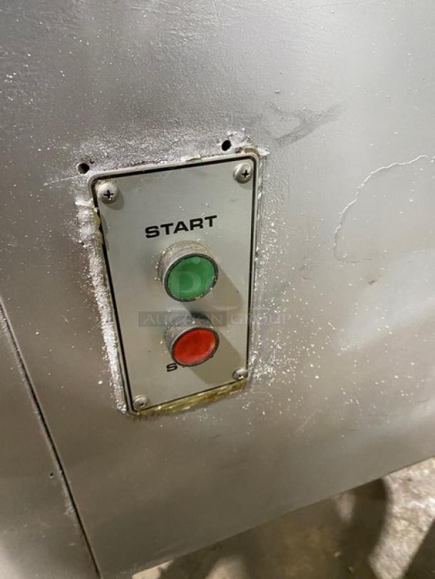 Hobart commercial electric meat chopper/grinder, sturdy metal body, start/stop buttons, high capacity, free-standing on legs.