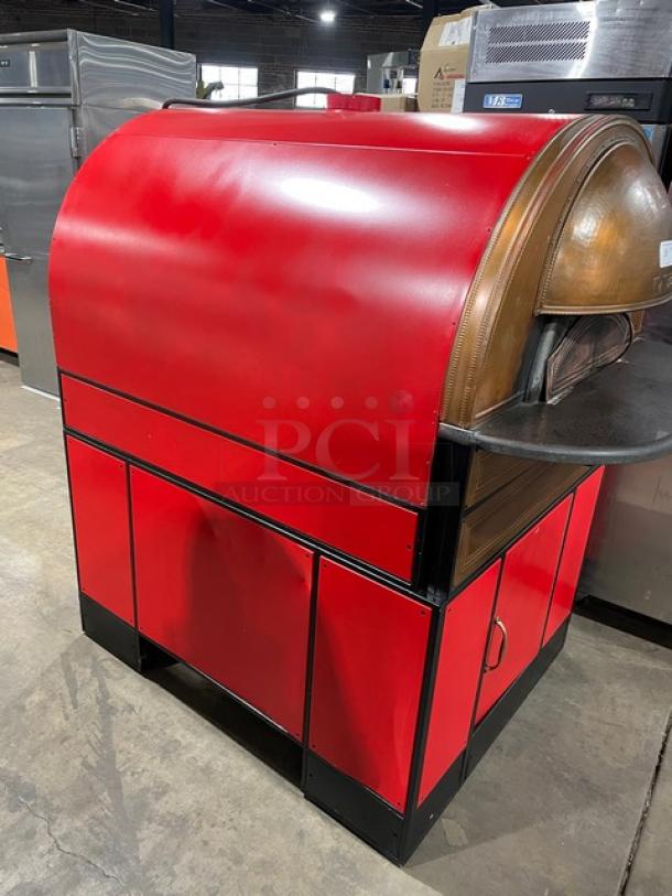 Izzo Forni red electric dome-style pizza oven, commercial-grade, with wooden pizza paddle, excellent condition.