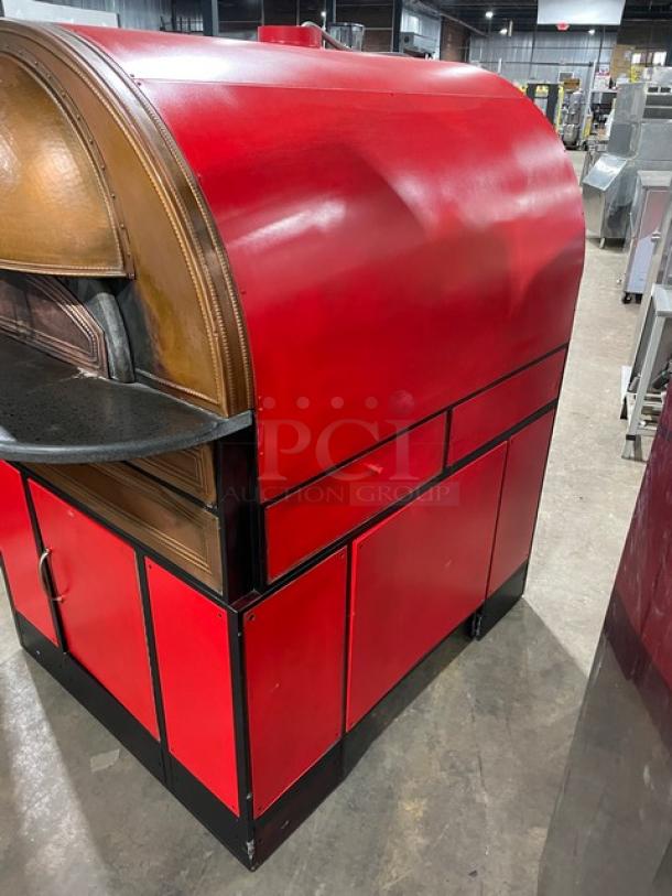 Izzo Forni commercial red, dome-style electric pizza oven in excellent condition. Includes a wooden pizza paddle.