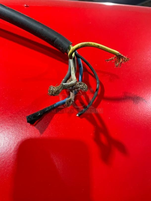 Red Izzo Forni electric Napoletano pizza oven with visible wiring. Includes wooden pizza paddle.