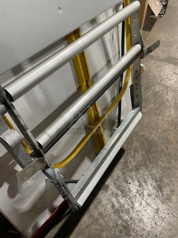 Seewer Rondo SS064C reversible dough sheeter, yellow, fold-up conveyor, on casters, commercial electric model, SN: A6019004.