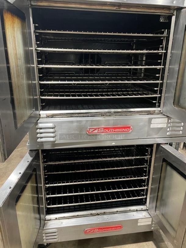 Southbend SL-Series stainless steel double-stacked convection oven with thermostatic control and wired racks, on casters.