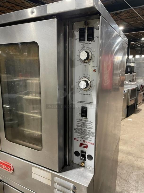 Southbend SL-Series stainless steel gas convection oven, double stacked, with thermostatic control, wired rack, on casters.