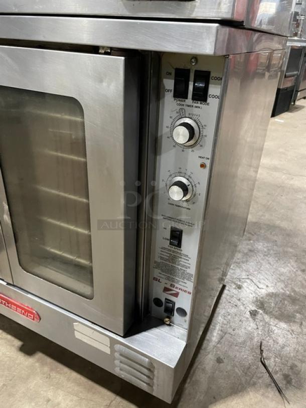 Southbend SL-Series stainless steel double-stacked convection oven, gas-powered, with thermostatic control and oven rack.