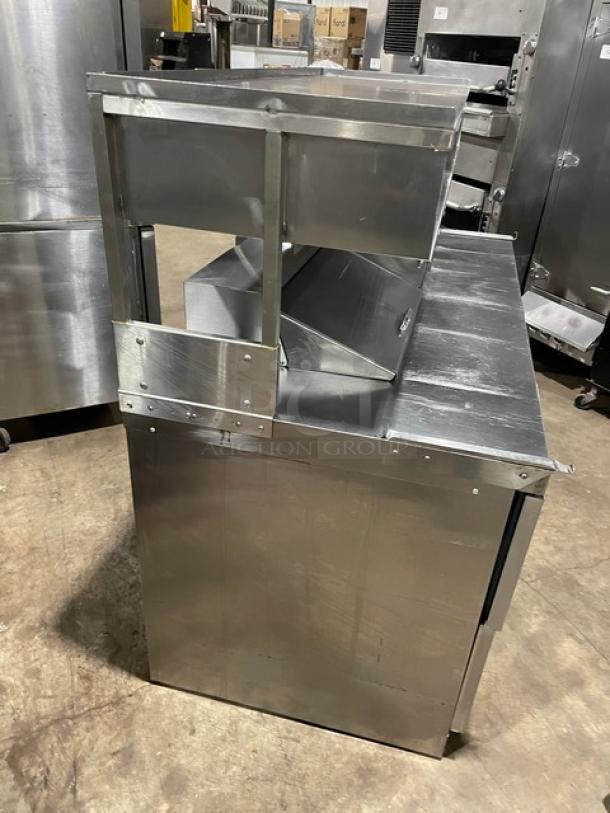 Delfield refrigerated prep table, model UCD4464N12DD5, stainless steel, 4 drawers, enclosed overhead storage, 115V, used.