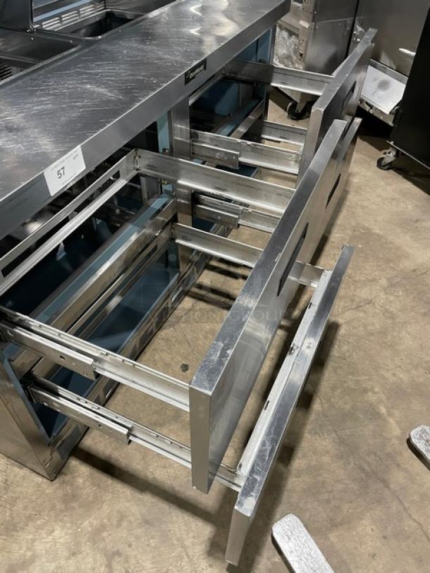 Delfield stainless steel refrigerated prep table, model UCD4464N12DD5, with 4 drawers and overhead storage, in good condition.