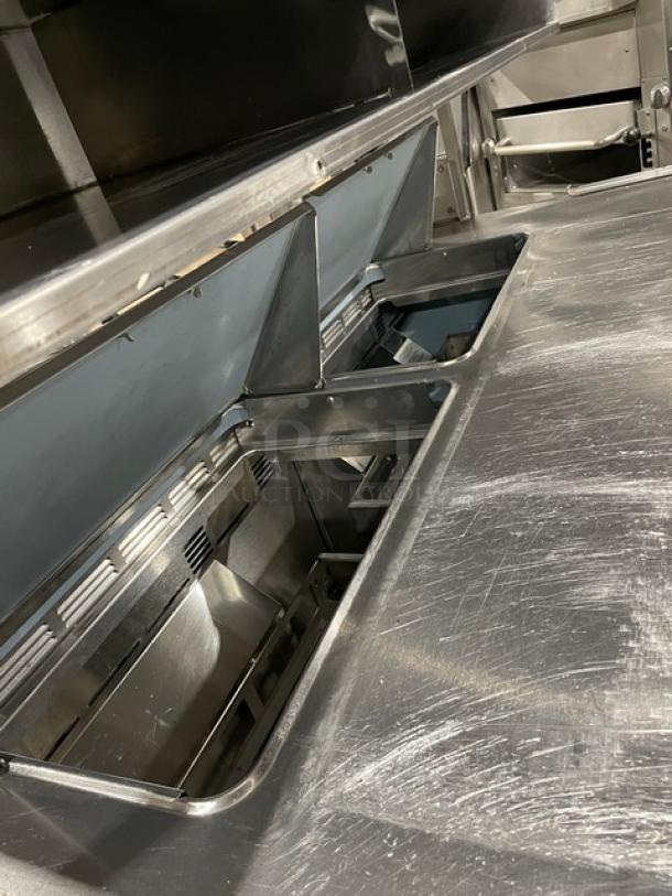 Delfield stainless steel 4-drawer refrigerated prep table, model UCD4464N12DD5, with overhead storage, used condition.