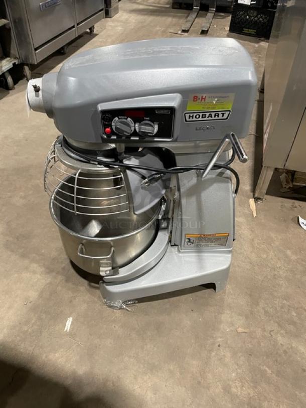 Hobart Legacy Series 20 Qt. Planetary Mixer, Model HL200-1STD, with stainless steel bowl guard and mixing bowl, on legs.