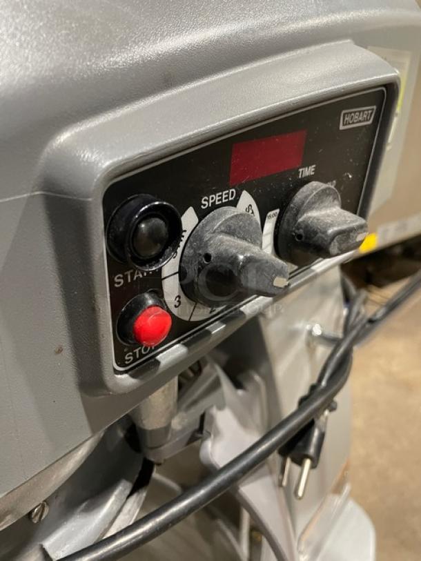 Hobart Legacy HL200-1STD mixer control panel with speed and time knobs, start/stop buttons, in used condition.