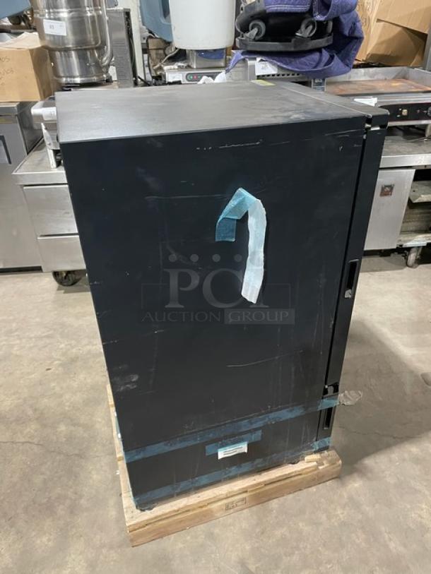 Vendo ICE-SC40BXIWU black single-door undercounter crystallizer/slush cooler, new scratch-n-dent condition, internal split doors.