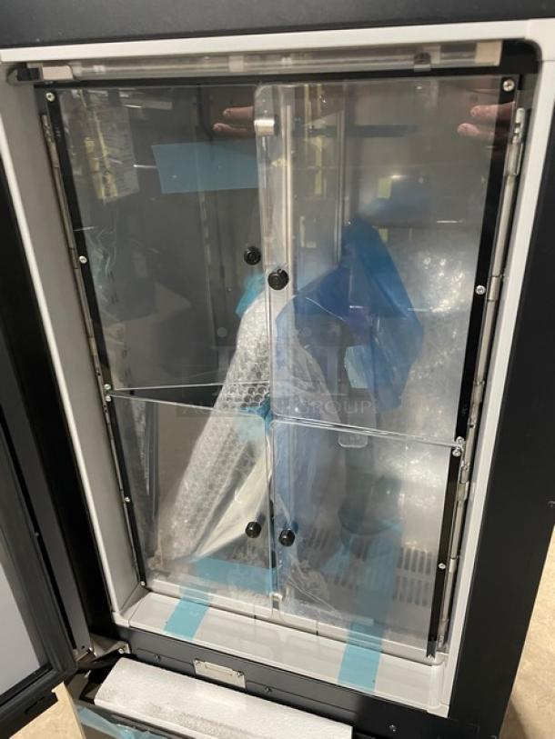 Vendo Lumilinna Series black single door undercounter super-cooling crystallizer, model ICE-SC40BXIWU, with internal split doors.