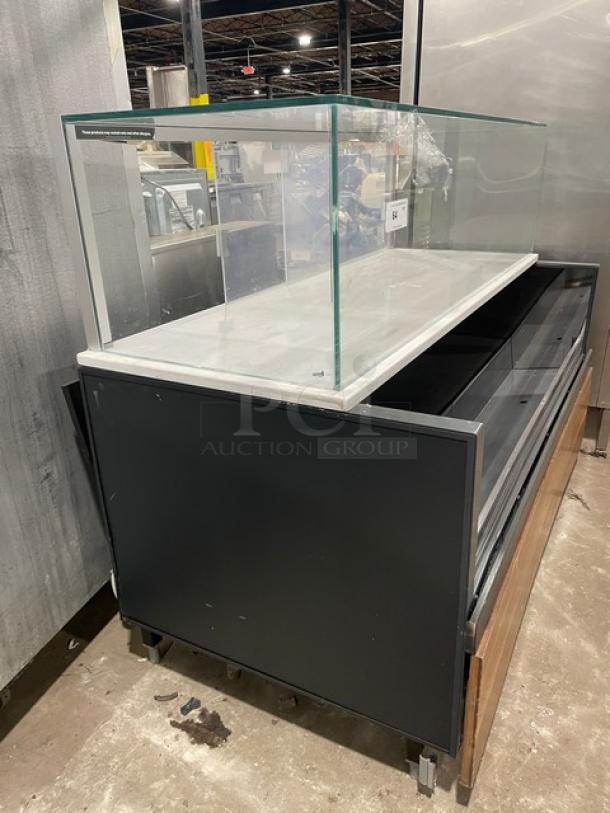 Structural Concepts SBZ6652DR commercial black refrigerated display case, glass top, rear sliding doors, on legs, 220V.