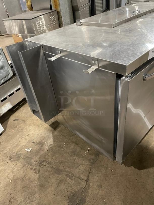 Continental RA68NB stainless steel refrigerated prep table, 2-1/2 doors, poly-coated wire rack, on casters, model number visible.
