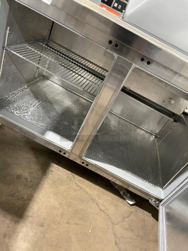 Continental RA68NB stainless steel refrigerated prep table with 2-1/2 doors, poly-coated wire rack, on casters. Model: RA68NB.