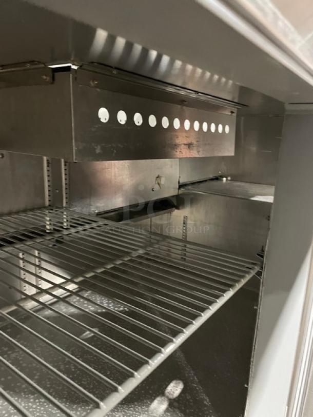 Continental Commercial Stainless Steel Salad/Sandwich Prep Table, Model RA68NB, with poly coated wired rack, on casters.