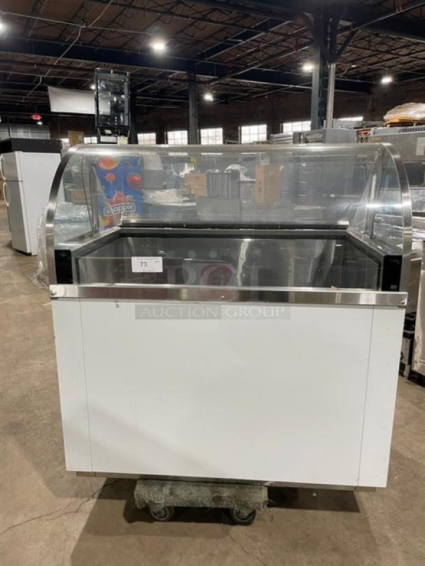 Commercial white curved glass 46" ice cream dipping cabinet, rear lift-open access, SN: N1902303, excellent condition.