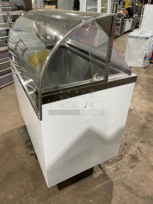 Commercial white curved glass 46" ice cream dipping cabinet with rear lift-open access, SN: N1902303, in good condition.