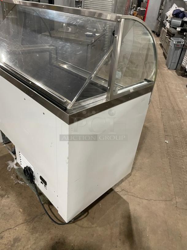 Commercial white curved glass 46" horizontal ice cream/frozen yogurt dipping cabinet with rear lift-open access, SN: N1902303.
