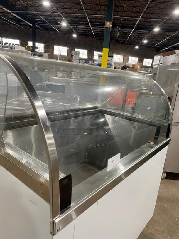 Commercial 46" curved glass ice cream dipping cabinet with rear lift-open access, white finish, SN: N1902303, used condition.