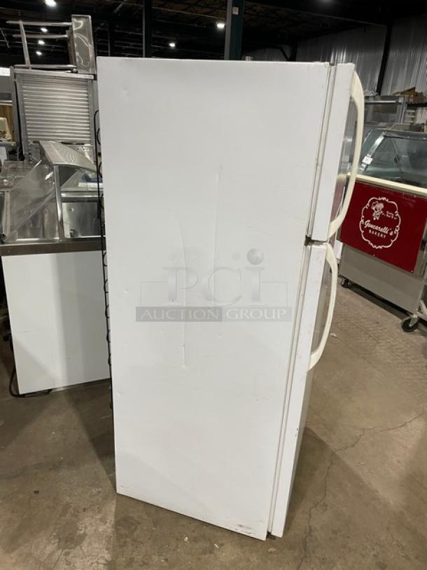 Frigidaire commercial white top-freezer/refrigerator combo, model MRT18DNEW0. Features poly-coated wire racks, pull-out drawers.