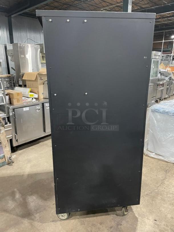 Vulcan Model 1013776 black 5-tier bakery merchandiser, stainless steel interior, lighted display, enclosed storage, on casters.