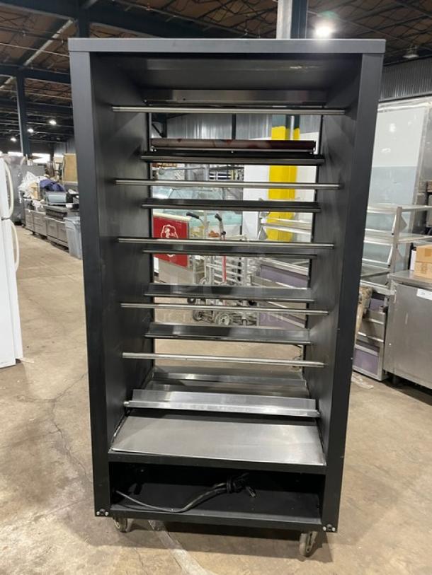 Vulcan 5-tier black bakery merchandiser, model 1013776, with lighted display, stainless steel interior, enclosed storage, on casters.