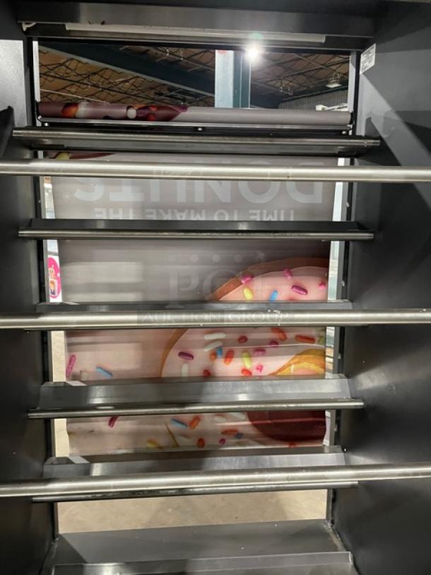 Vulcan Model 1013776 black five-tier bakery display showcase with lighting, stainless steel interior, and enclosed storage. On casters.