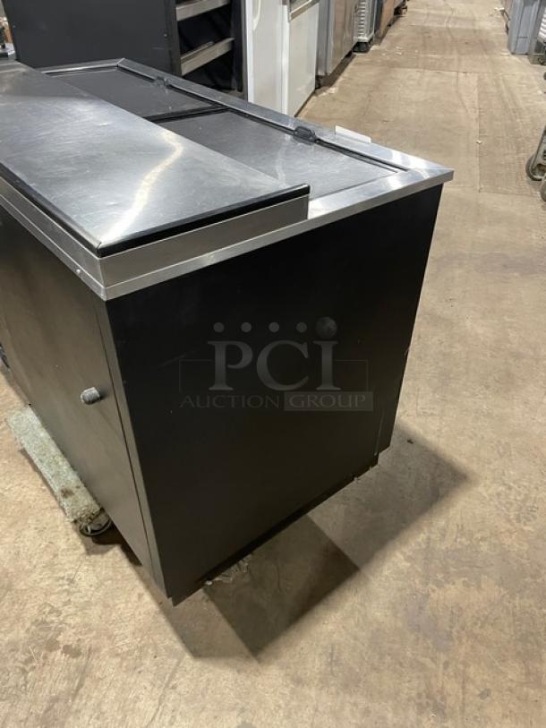 True Commercial Black 50" Bottle Cooler, Model TD-50-18, with stainless worktop, dual slide lids, 115V, good condition.