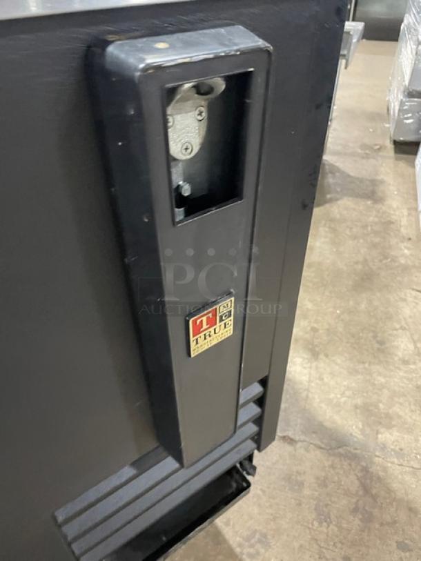 True TD-50-18 commercial black 50" bottle cooler with stainless worktop, dual easy-slide lids. Model: TD5018, SN: 6945613.
