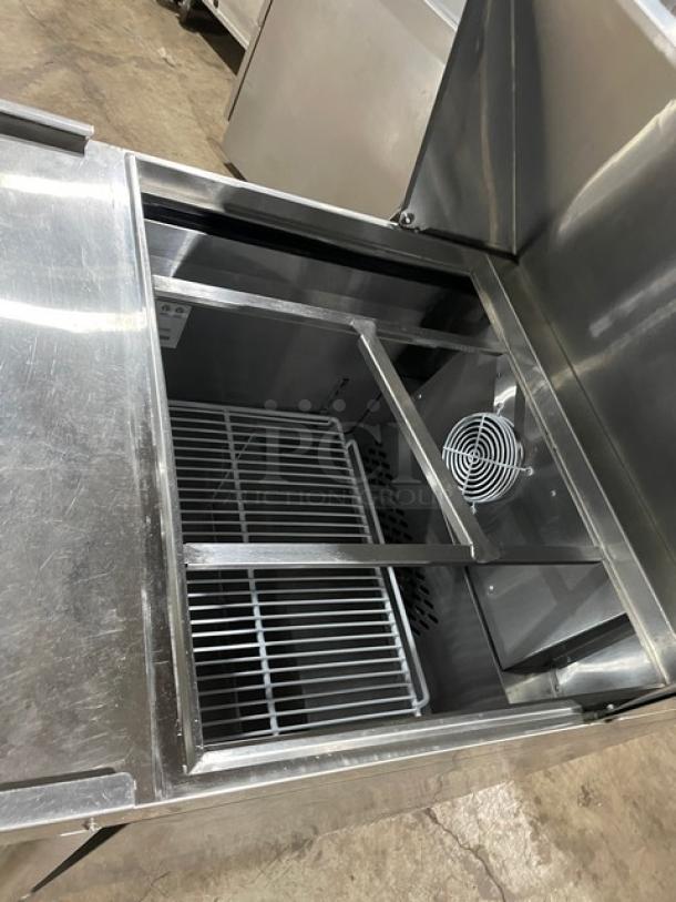 Atosa 2021 stainless steel refrigerated prep table, Model MSF8305GR, with poly coated rack and casters, excellent condition.