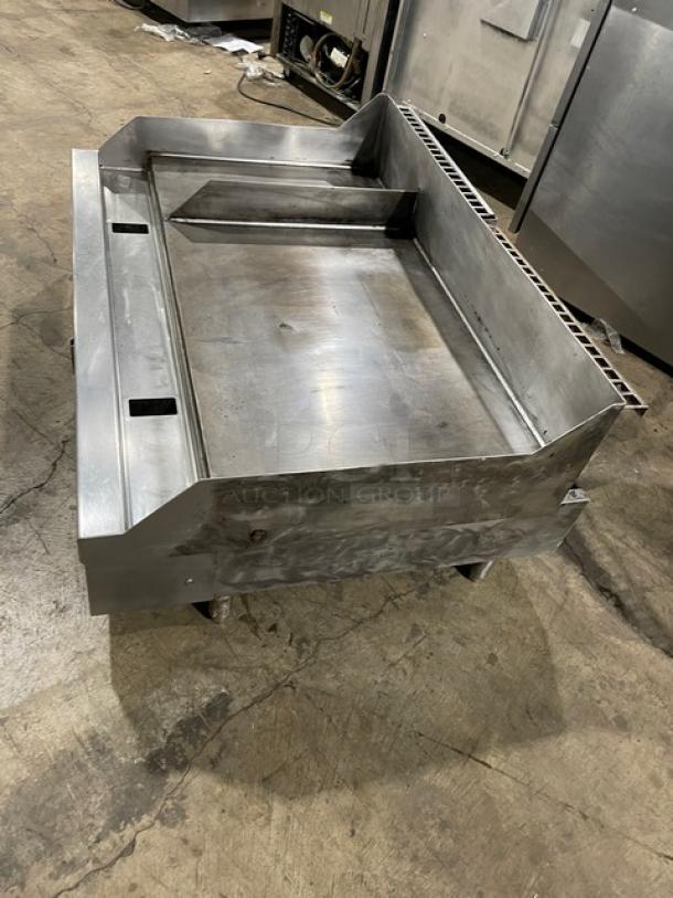 Woodstone stainless steel natural gas plancha griddle with back and side splash. Split-top style, commercial-grade condition.