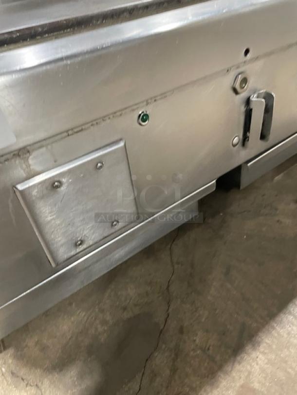 Woodstone stainless steel gas countertop plancha griddle with split-top, back, and side splash. Used, good condition.