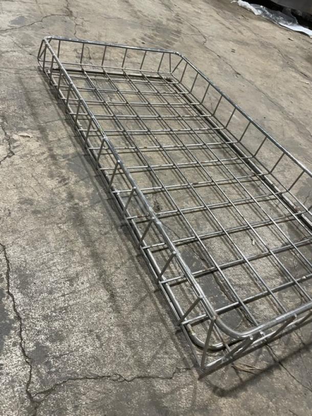 Commercial full-size chrome plated wire rack for bagels/pastries, sturdy design, good condition, ideal for bakery use.