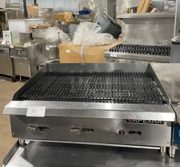 Apexra commercial stainless steel gas char broiler with back and side splash, on legs, like new condition.