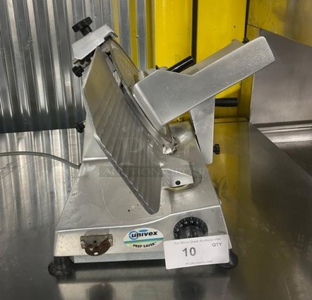 Univex Commercial Electric Countertop Meat Deli Slicer with legs, metallic finish. Model details not visible.