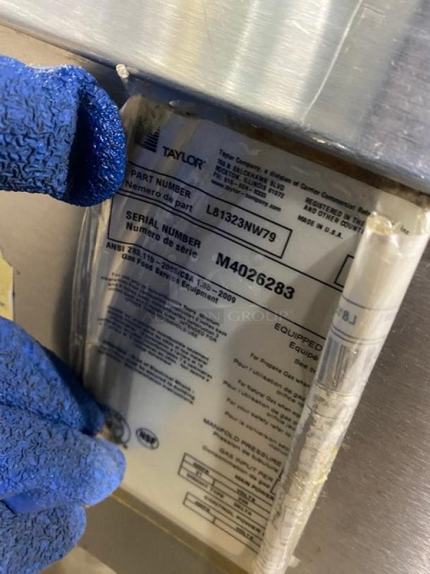 Taylor L813 stainless steel double platen 36" griddle on casters. Model: L813, SN: M4026283. Label details visible.