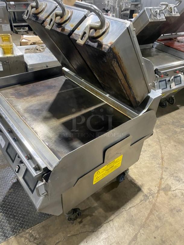 Taylor L81123 commercial stainless steel triple platen griddle, 36", dual-sided, programmable controls, on casters.