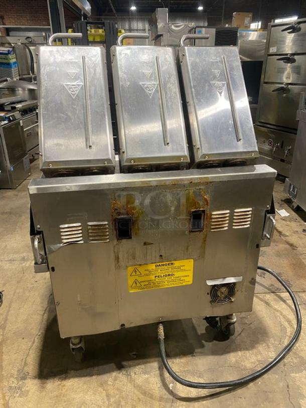 Taylor L81123 stainless steel 36" flat griddle, triple platen, dual-sided, on casters. Propane/electric, programmable controls.