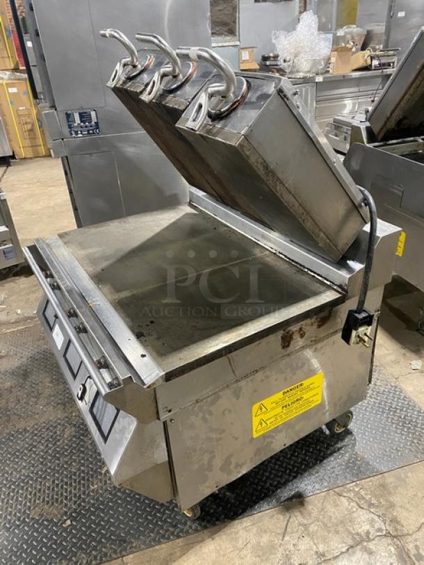 Taylor L811-22 stainless steel griddle, 36" triple platen, dual-sided, on casters. Features programmable controls. Model: L81122.