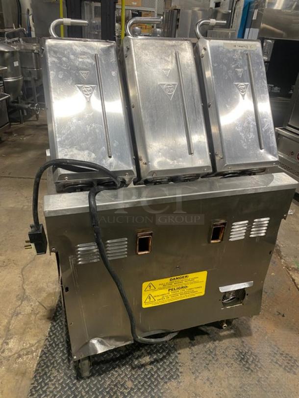 Taylor L811-22 stainless steel griddle with triple platen, dual-sided, programmable controls, 36" width, on casters.